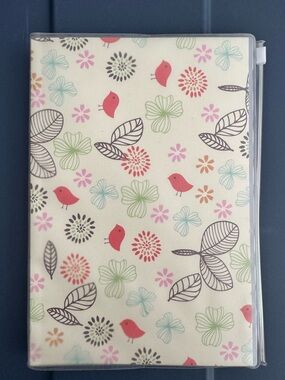 New whimsical pattern, lined  journal/notebook in plastic with a pouch